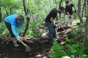 Volunteers working on a trail