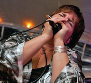 Diane Blue playing the harmonica