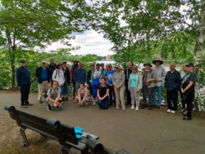 Group of Riverfest walkers gathered along the Charles on the multi-use path.